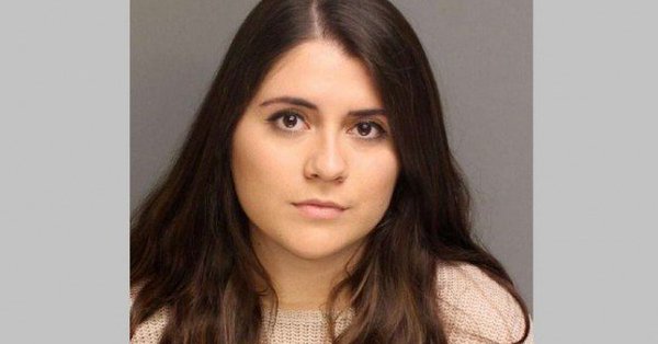 Photo published for NY woman charged with falsely reporting that 2 football players raped her in bathroom